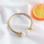 Ατσάλινη χειροπέδα σε διχρωμία με πέρλες – Mixed Pearl