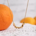 Επίχρυσο κολιέ από ανοξείδωτο ατσάλι με ρευστά στοιχεία- Organic Flow